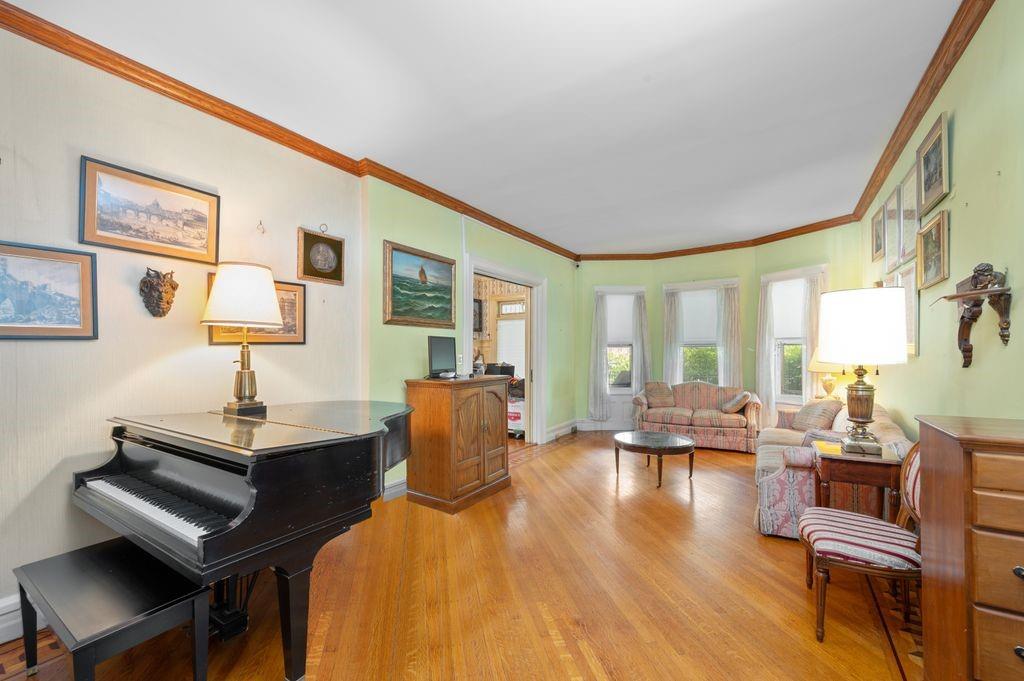 475 Argyle Road Brooklyn, NY 11218 - Photo 10 of 35 a living room with furniture and a wooden floor