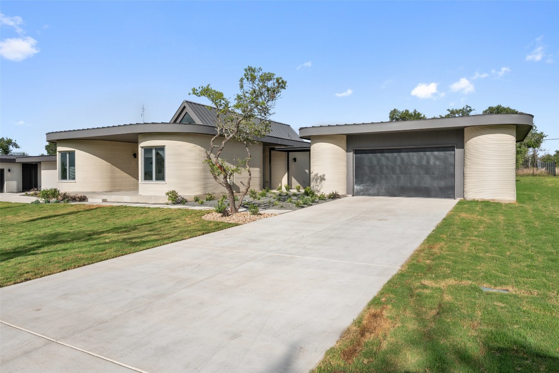 40 Peace Pipe Wimberley, TX 78676 - Photo 18 of 23 a front view of a house with a yard and garage