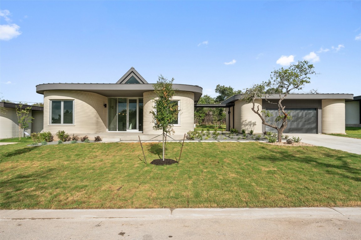 40 Peace Pipe Wimberley, TX 78676 - Photo 2 of 23 a front view of a house with garden