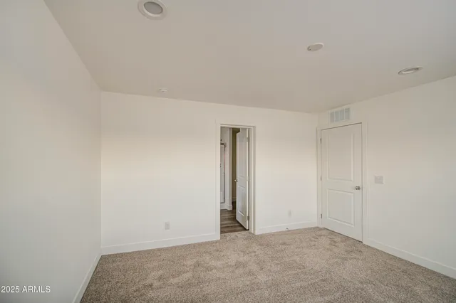 a bathroom with a sink a mirror and a window