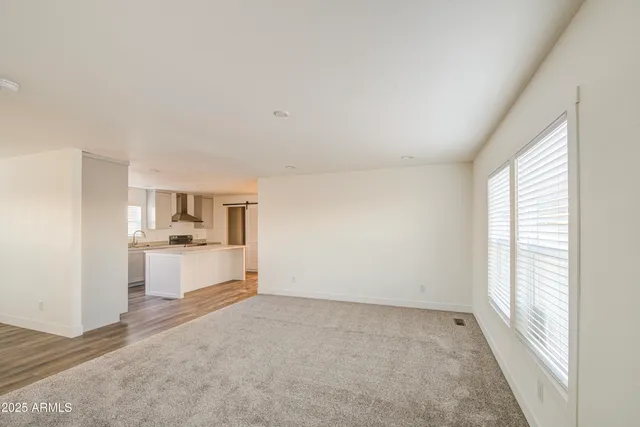 a view of a kitchen with microwave and cabinets