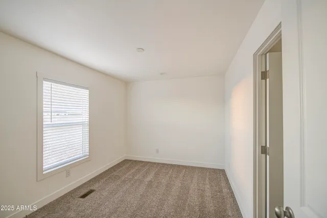 a bathroom with a granite countertop sink a mirror and a shower