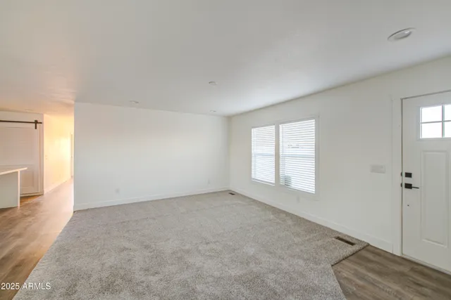 an empty room with windows