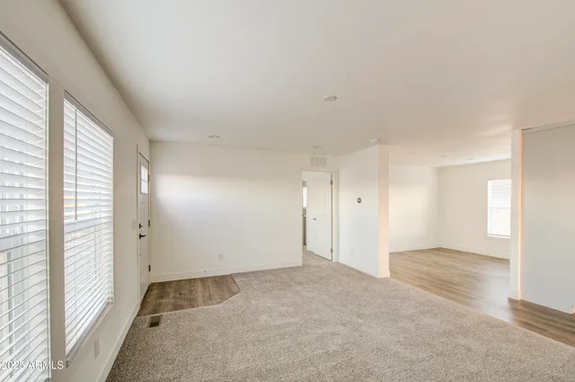 a view of an empty room with a window