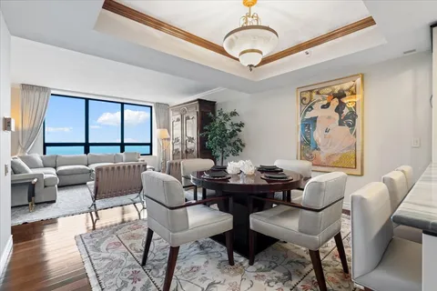 a view of a livingroom with furniture window and wooden floor