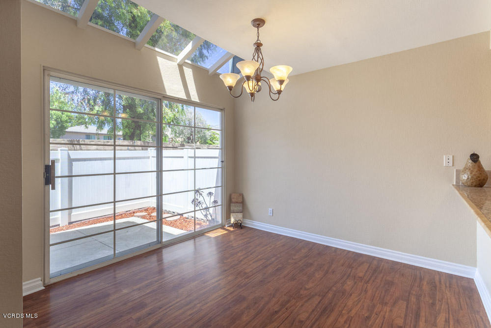 1990 Rory Lane, Unit 3 Simi Valley, CA 93063 - Photo 7 of 22 a view of a livingroom with wooden floor and a large window