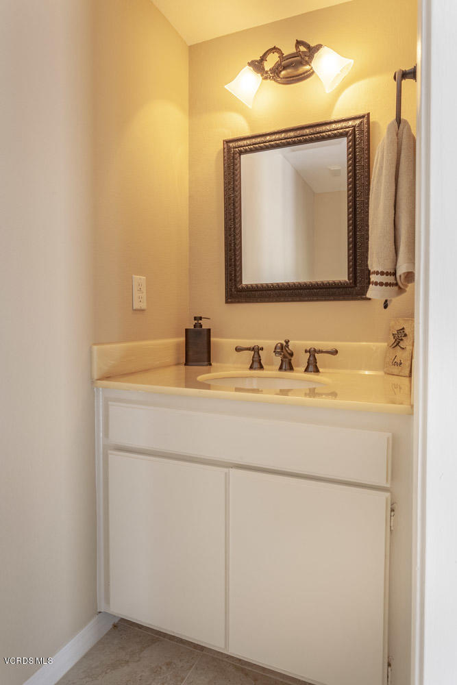 1990 Rory Lane, Unit 3 Simi Valley, CA 93063 - Photo 8 of 22 a bathroom with a sink and a mirror