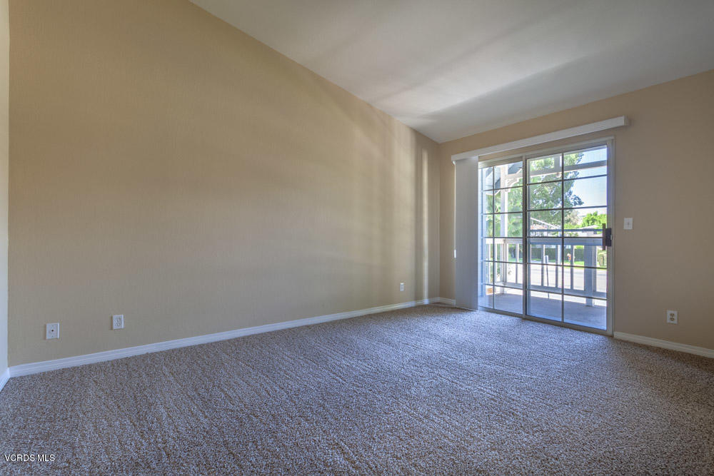1990 Rory Lane, Unit 3 Simi Valley, CA 93063 - Photo 10 of 22 a view of an empty room with wooden floor and a window