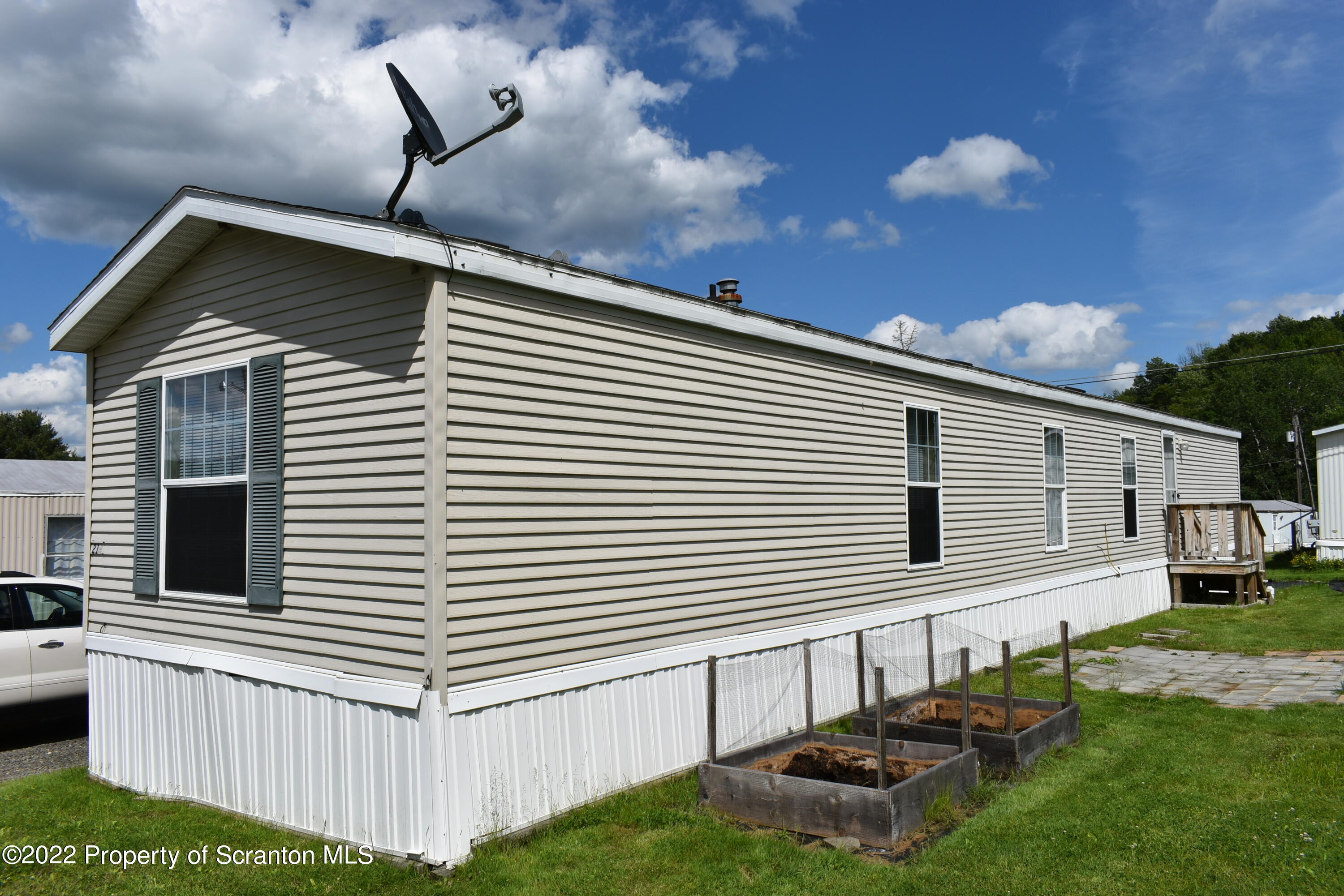 940 Nowlan Road Port Crane, NY 13833 - Photo 4 of 12 a front view of a house with a yard