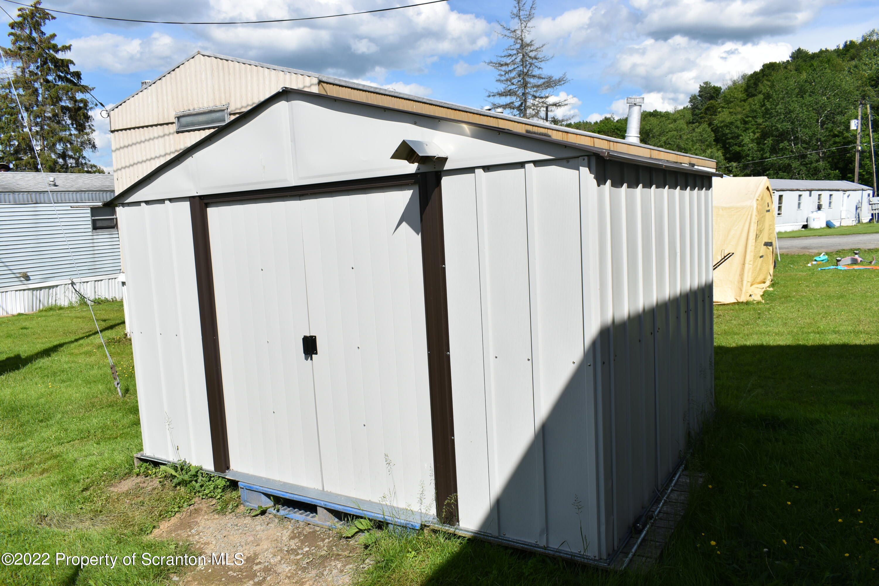 940 Nowlan Road Port Crane, NY 13833 - Photo 5 of 12 a view of a house with backyard and garden