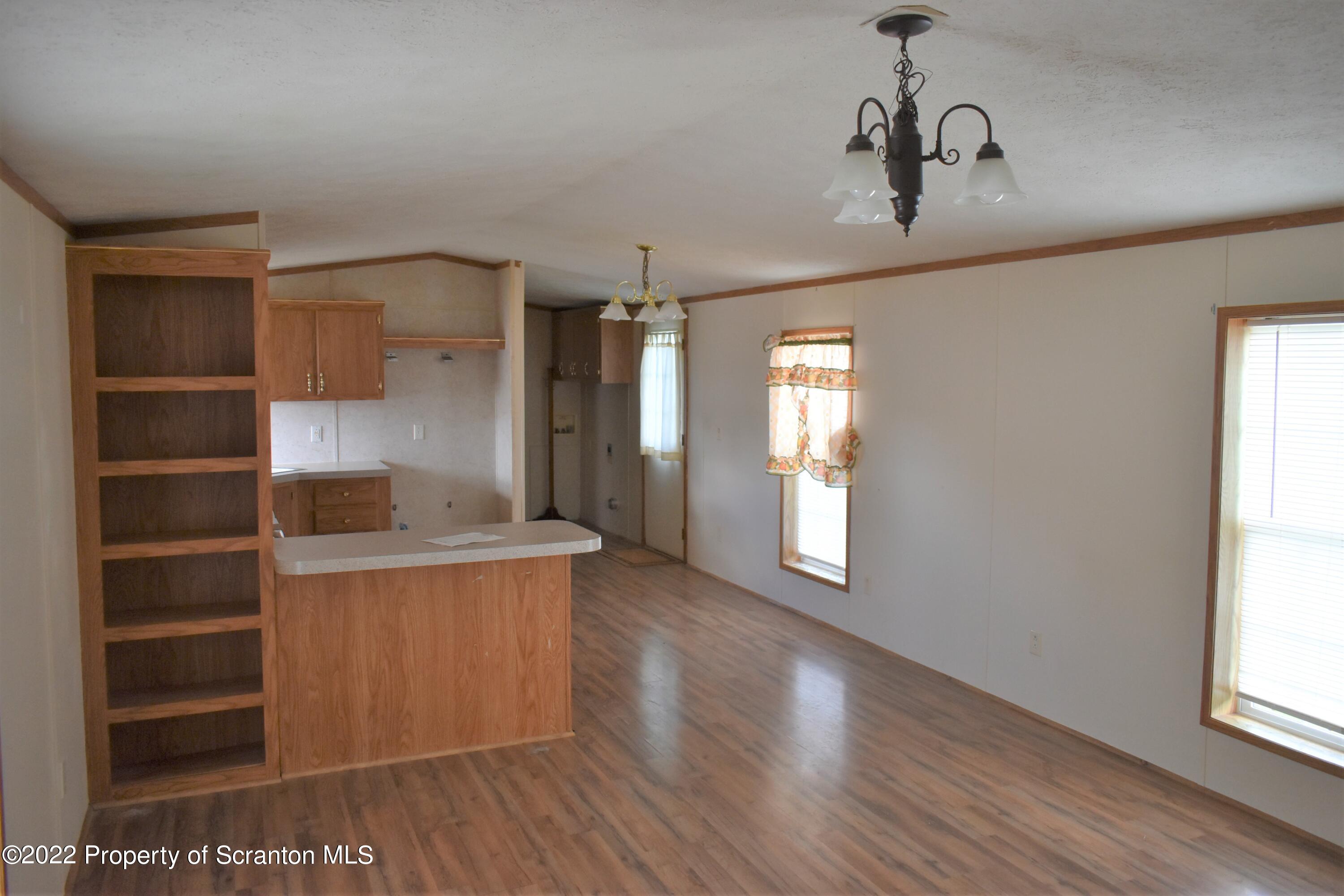 940 Nowlan Road Port Crane, NY 13833 - Photo 10 of 12 a view of a kitchen and an empty room with a window