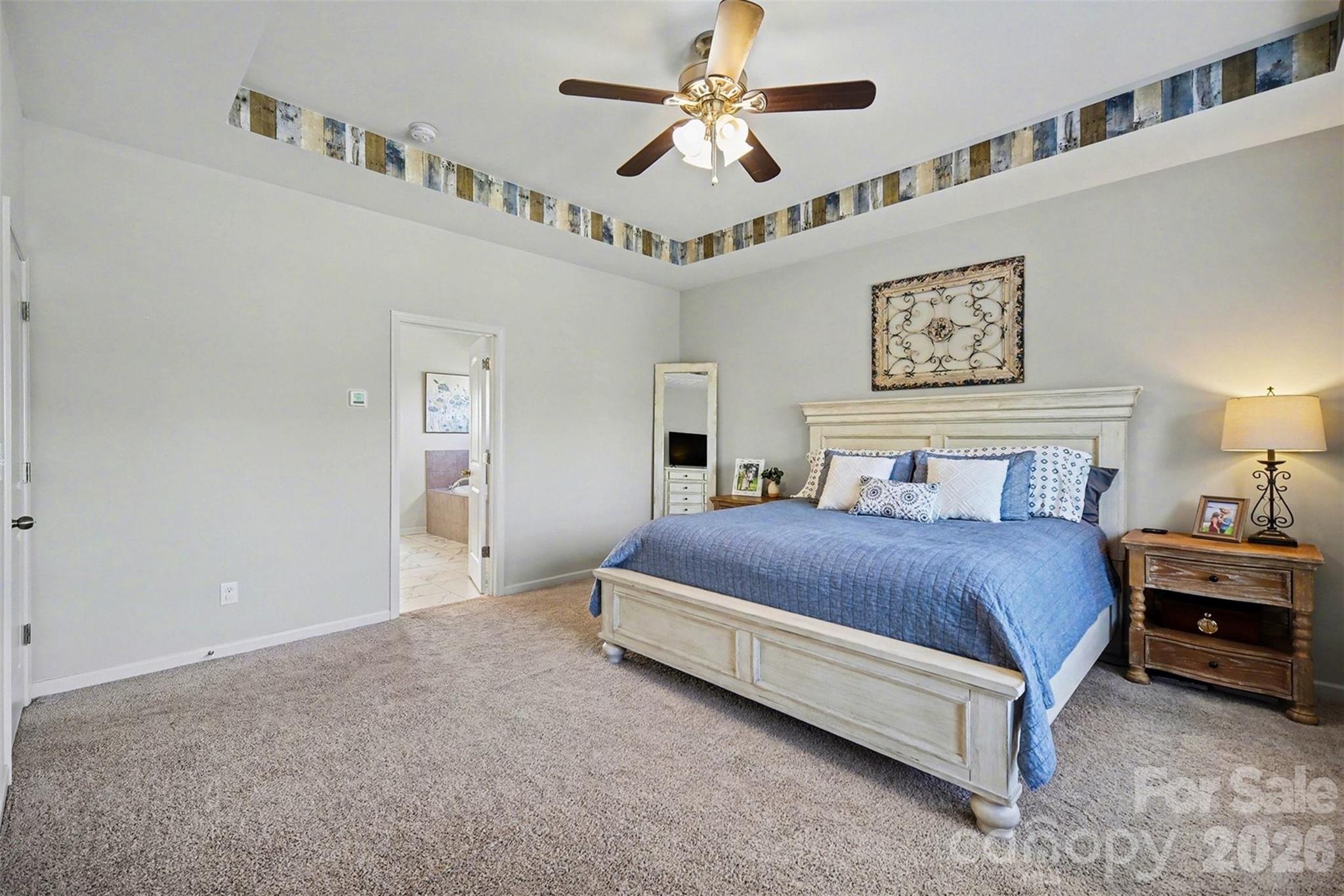 514 Tack Lane Midland, NC 28107 - Photo 24 of 48 a bedroom with a bed chandelier and a window