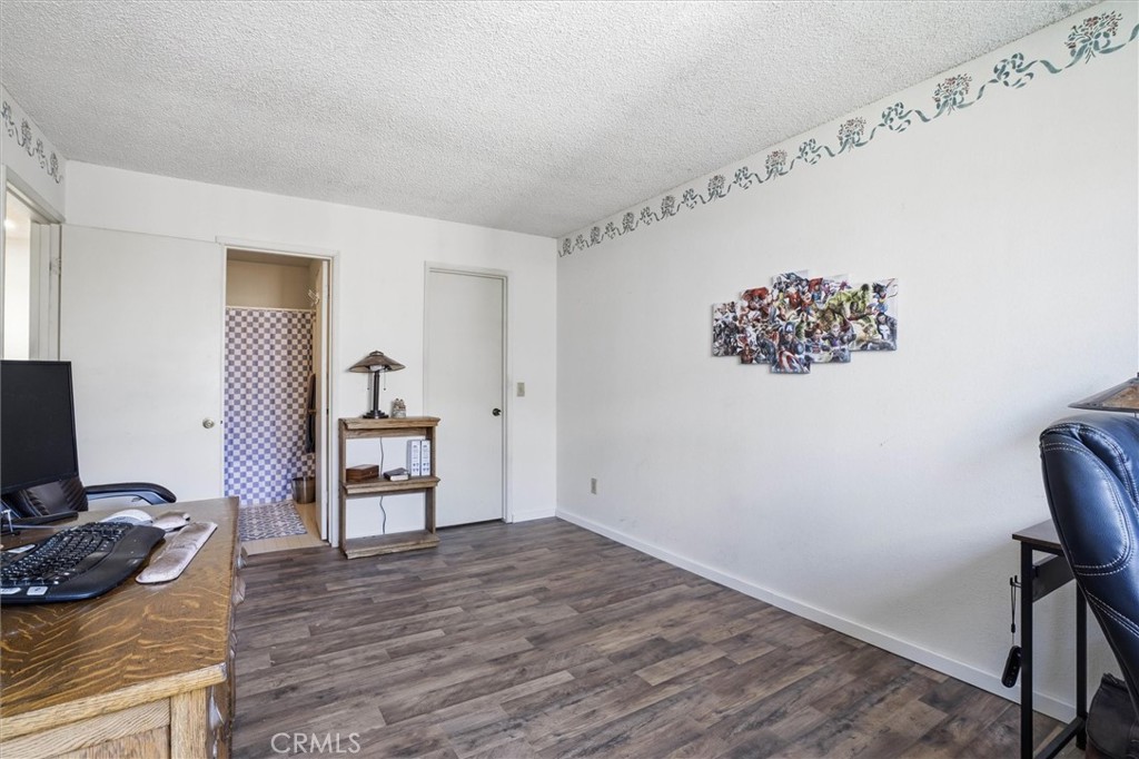 2483 Country Santa Maria, CA 93455 - Photo 16 of 19 a view of a workspace with furniture and wooden floor