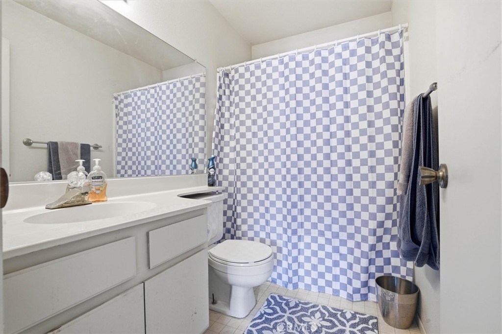 2483 Country Santa Maria, CA 93455 - Photo 17 of 19 a bathroom with a sink toilet and a mirror