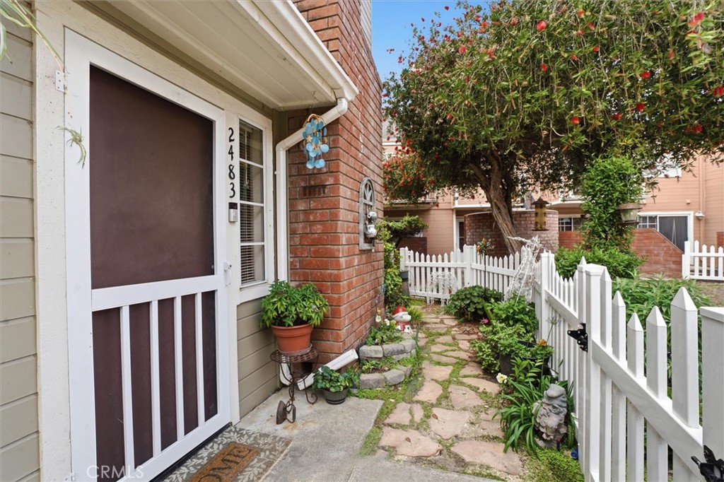 2483 Country Santa Maria, CA 93455 - Photo 2 of 19 a view of a house with wooden fence