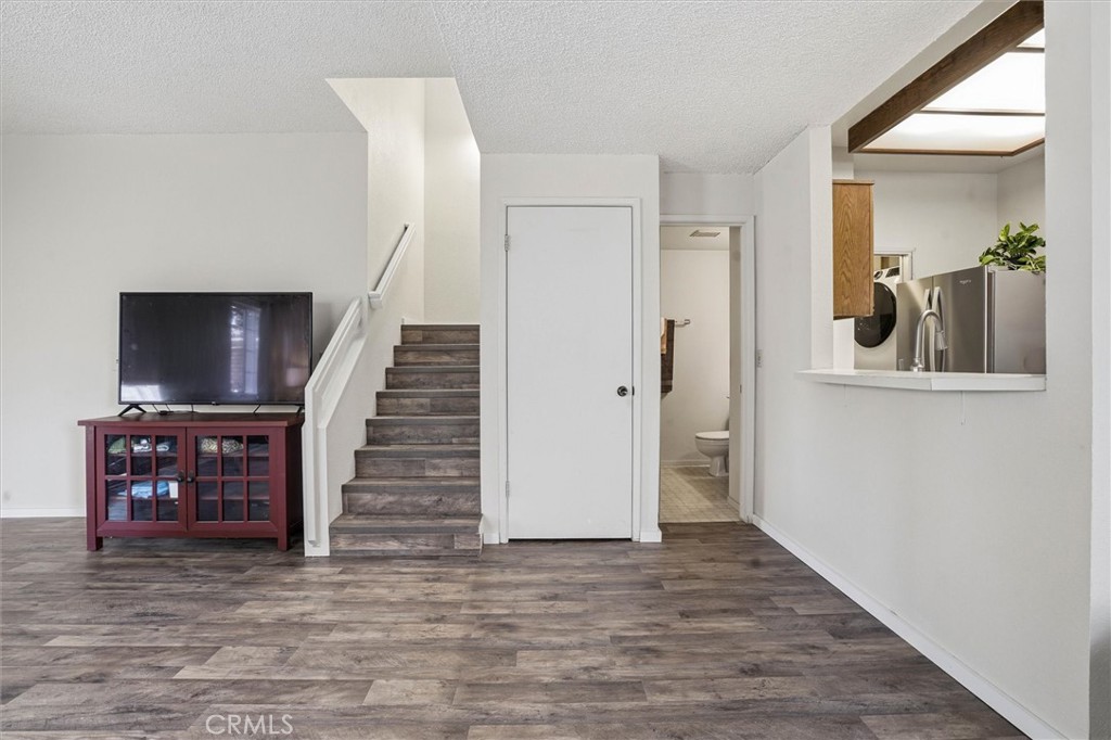 2483 Country Santa Maria, CA 93455 - Photo 10 of 19 a view of a livingroom with wooden floor and stairs
