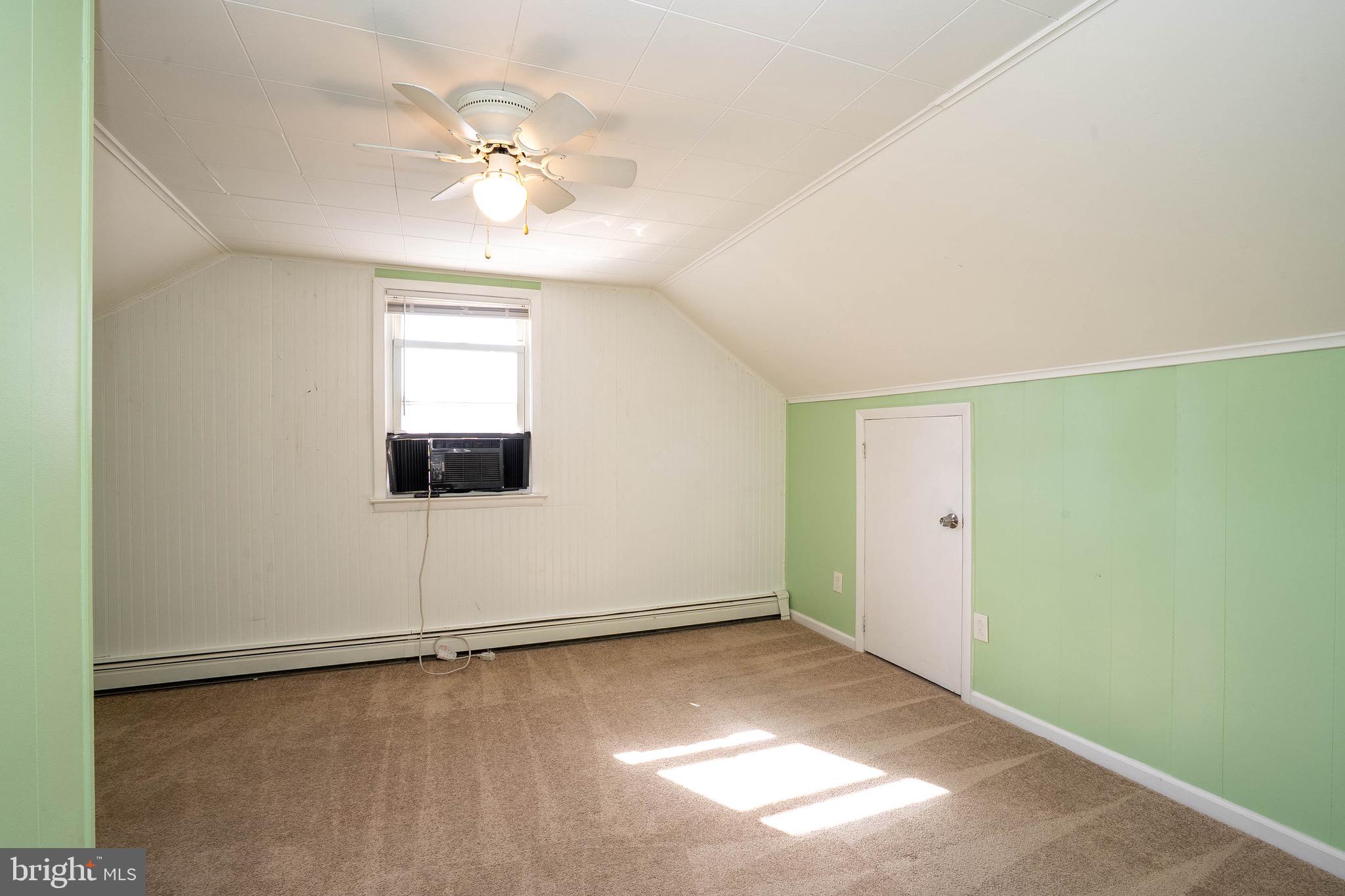 135 Keswick Avenue Ewing, NJ 08638 - Photo 16 of 22 an empty room with a ceiling fan and window
