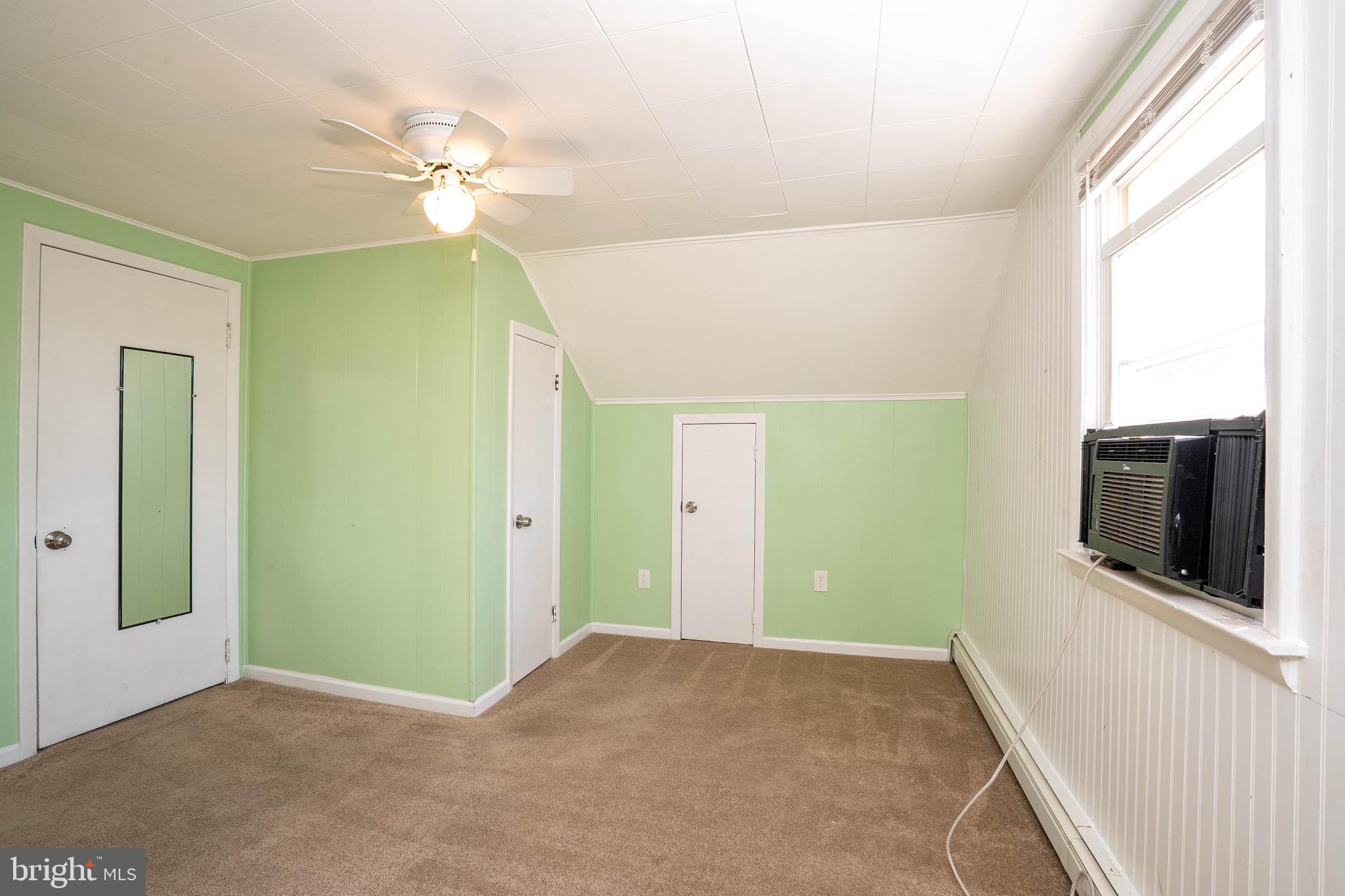 135 Keswick Avenue Ewing, NJ 08638 - Photo 18 of 22 a view of a hallway with a flat screen tv
