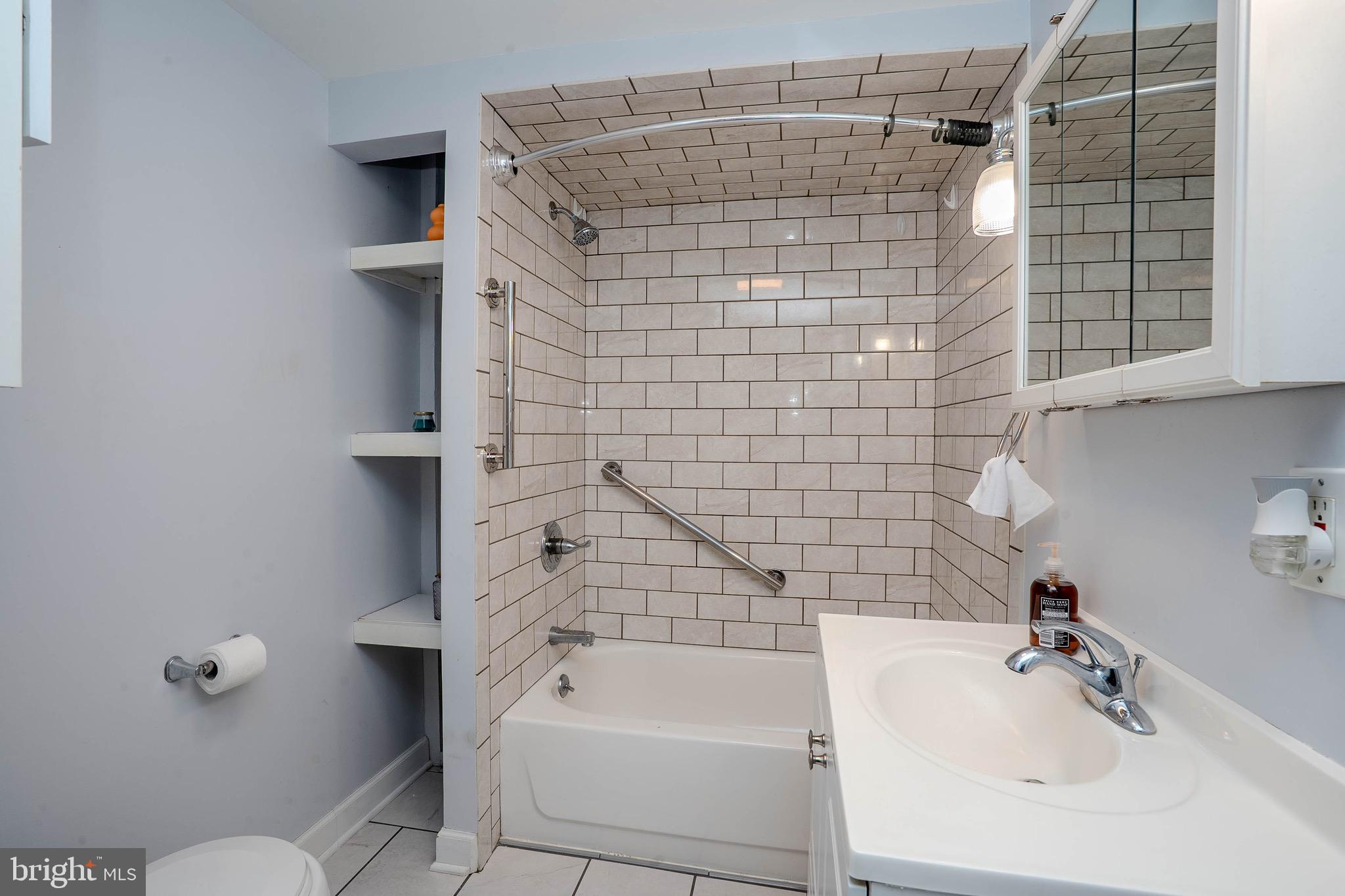 135 Keswick Avenue Ewing, NJ 08638 - Photo 10 of 22 a bathroom with a shower and a sink