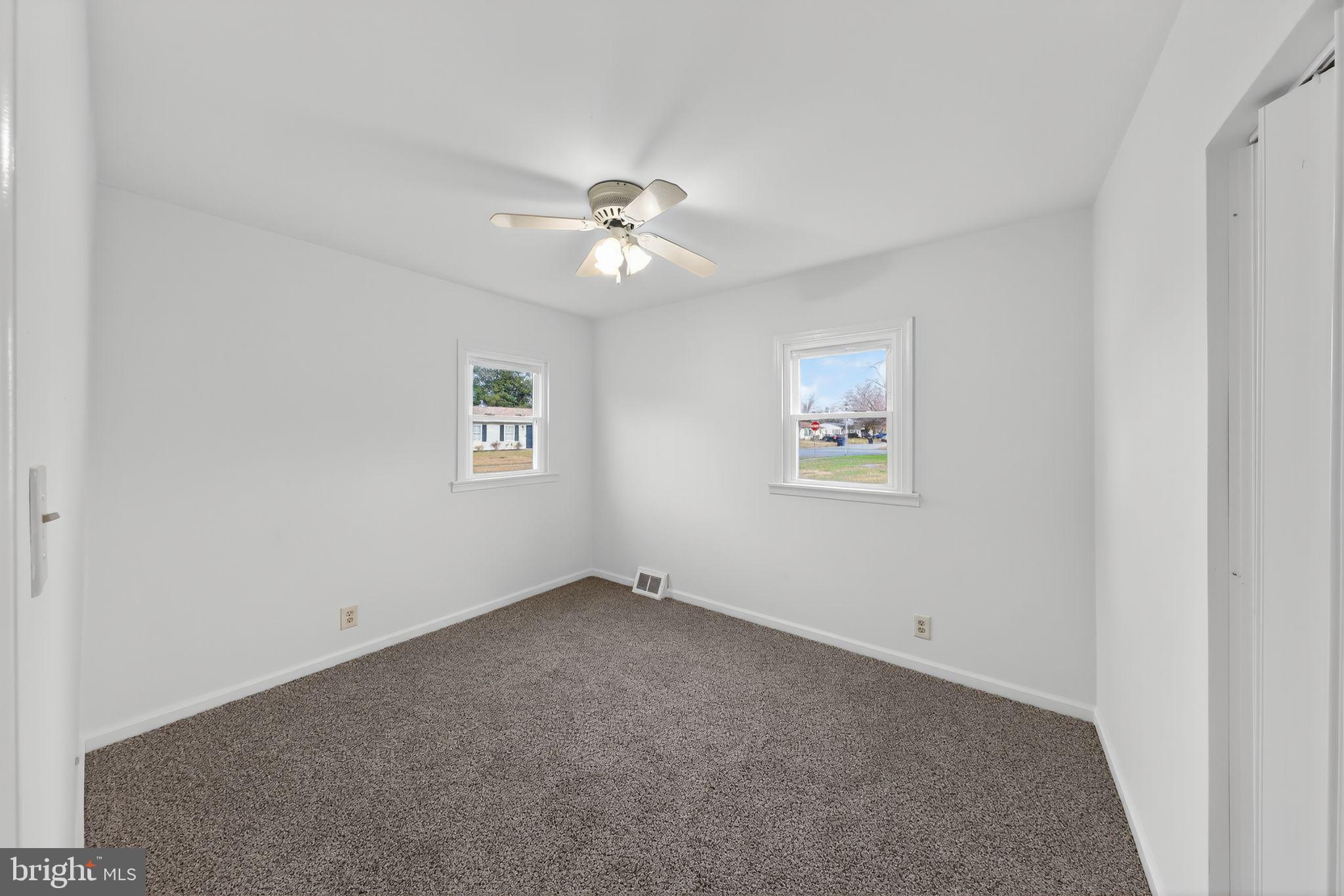 68 Saxton Road Dover, DE 19901 - Photo 16 of 24 an empty room with a window and a fan