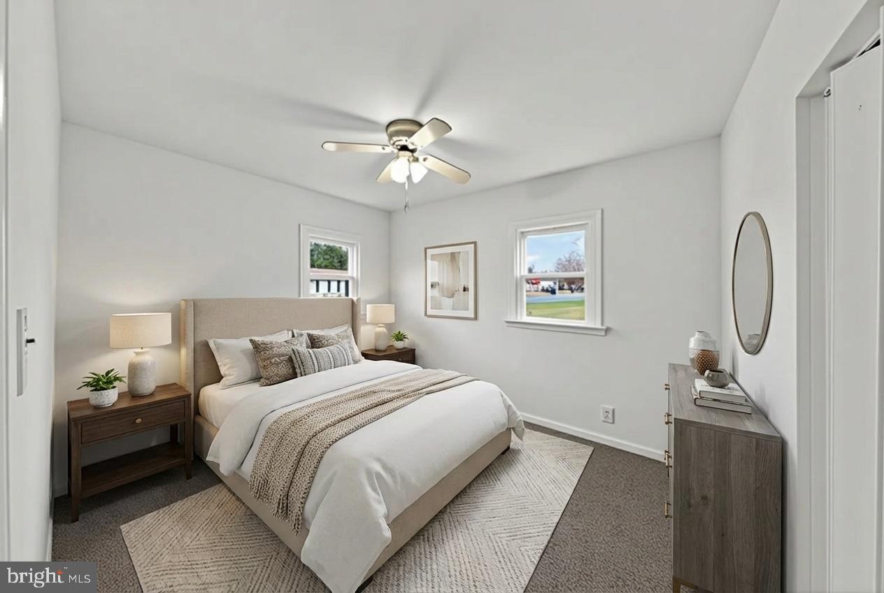 68 Saxton Road Dover, DE 19901 - Photo 17 of 24 a bedroom with a bed and a chandelier