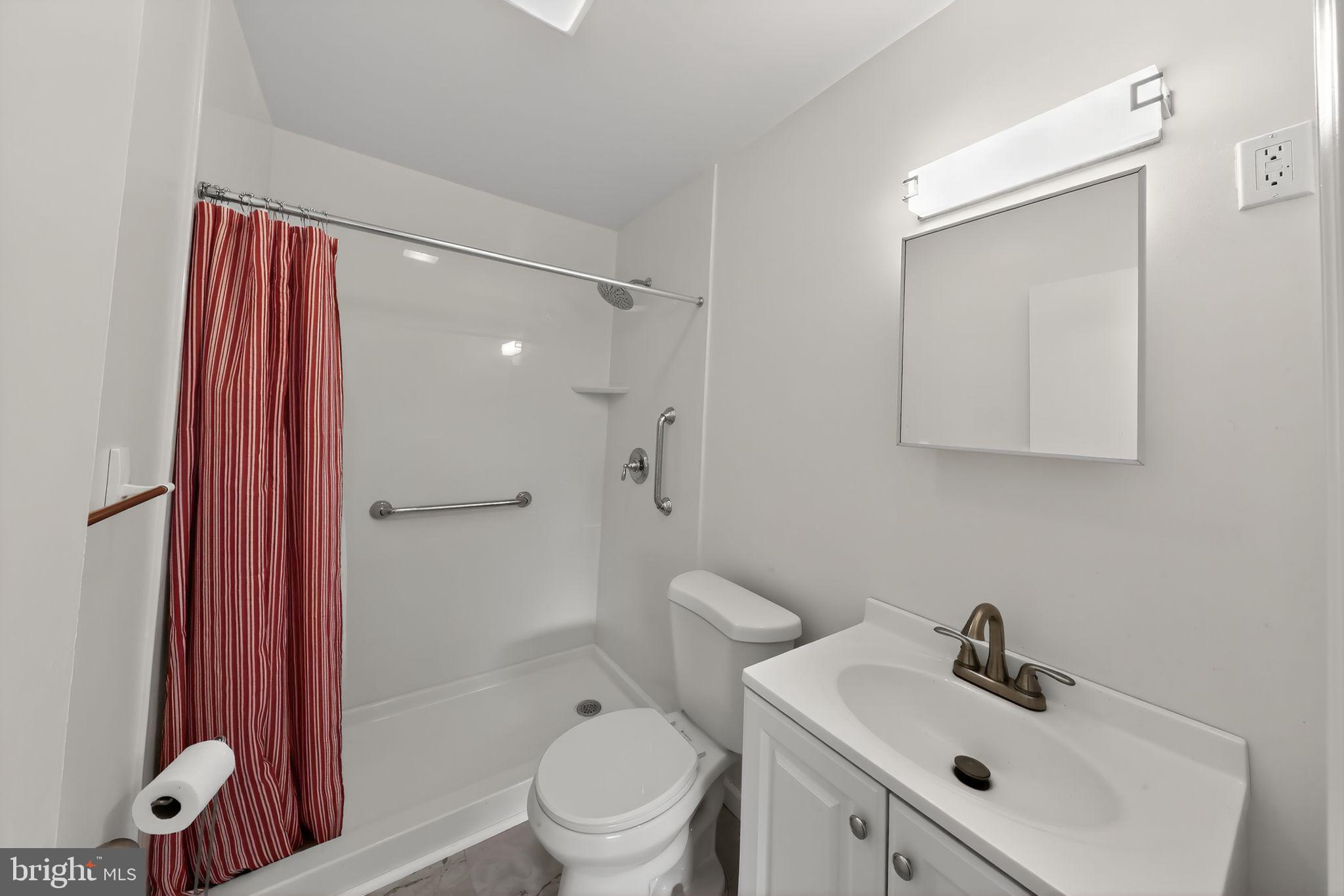 68 Saxton Road Dover, DE 19901 - Photo 20 of 24 a bathroom with a sink a toilet and shower
