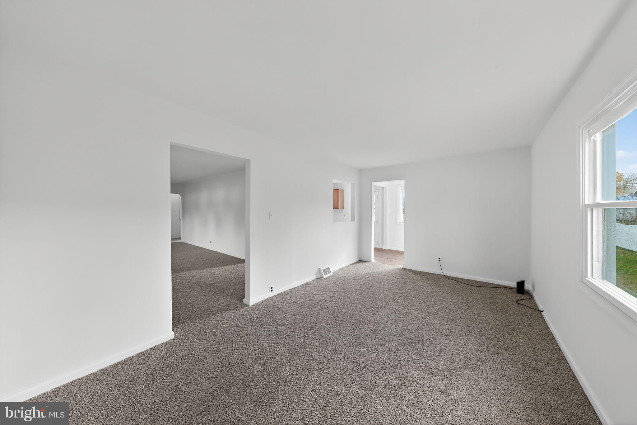 68 Saxton Road Dover, DE 19901 - Photo 3 of 24 an empty room with windows