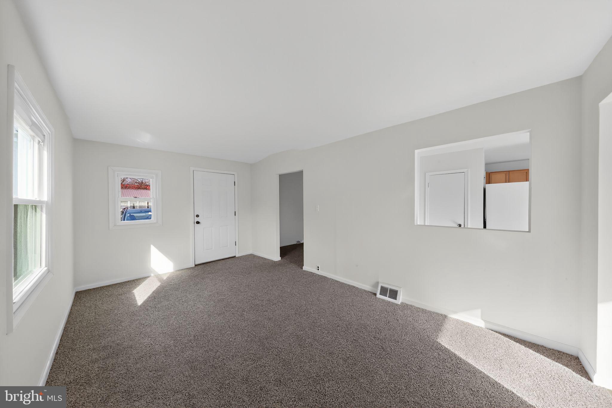 68 Saxton Road Dover, DE 19901 - Photo 4 of 24 a view of an empty room with a window