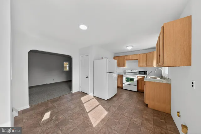a view of a kitchen with a sink