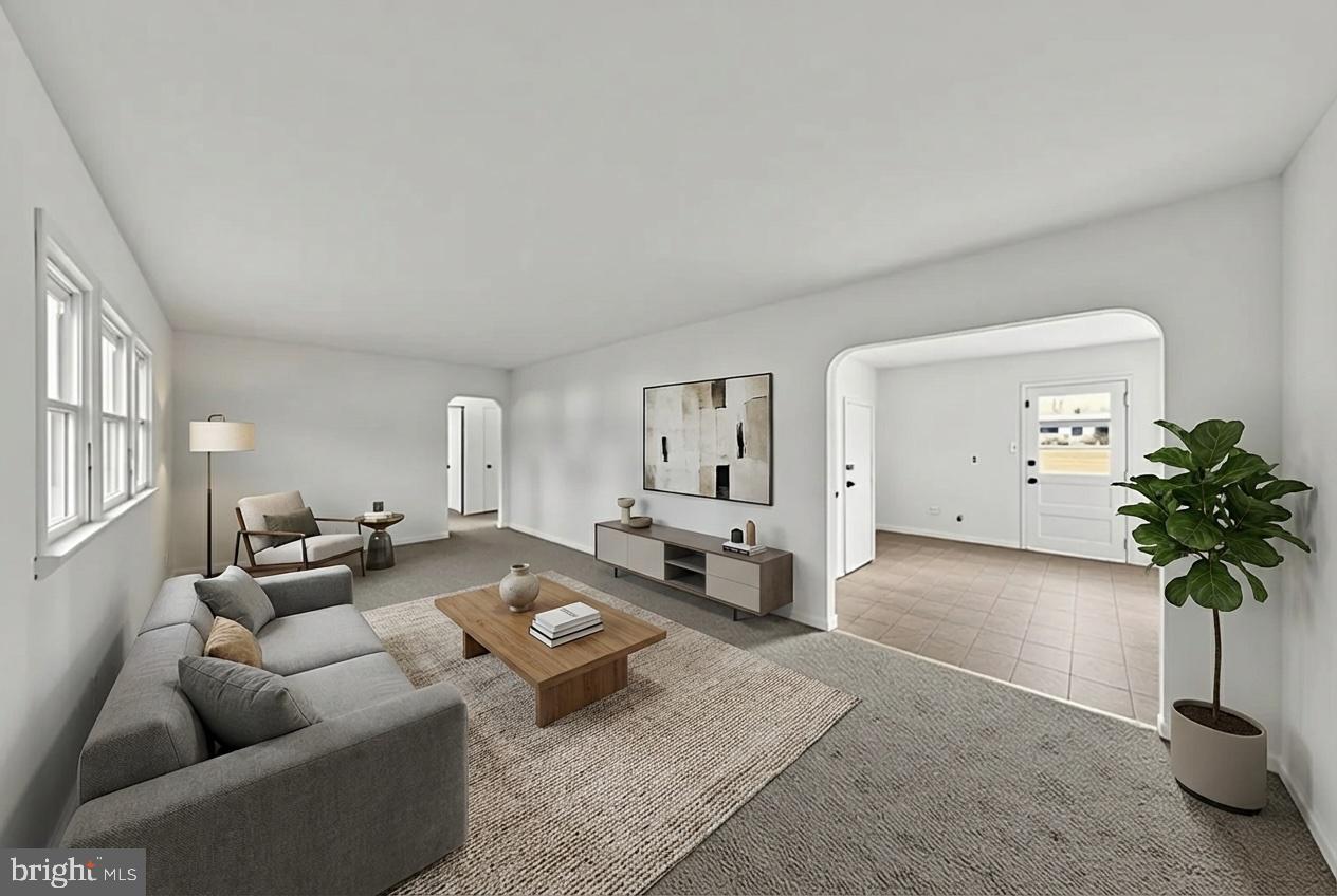 68 Saxton Road Dover, DE 19901 - Photo 7 of 24 a living room with furniture potted plant and a window