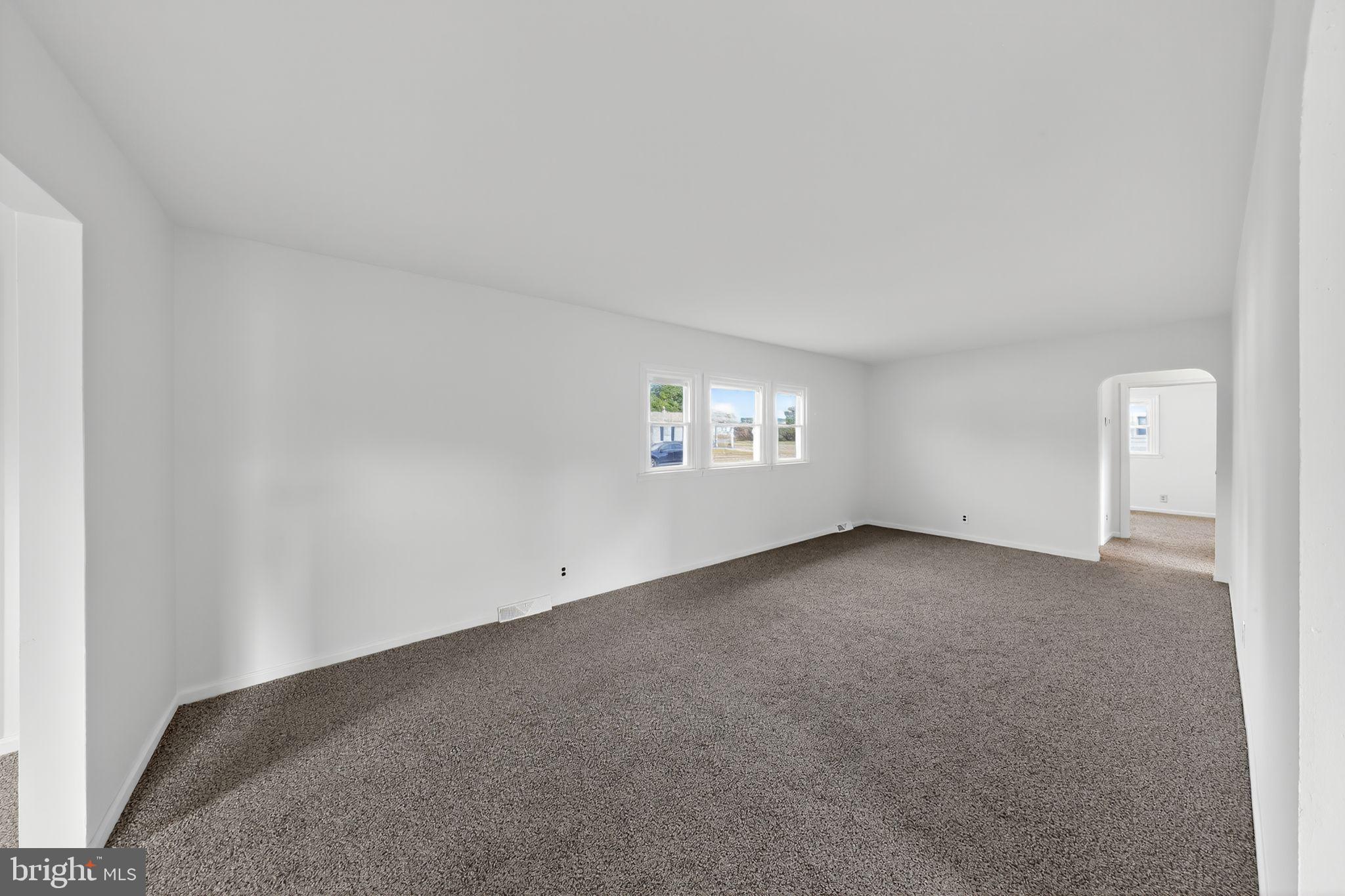 68 Saxton Road Dover, DE 19901 - Photo 8 of 24 a view of an empty room with a window