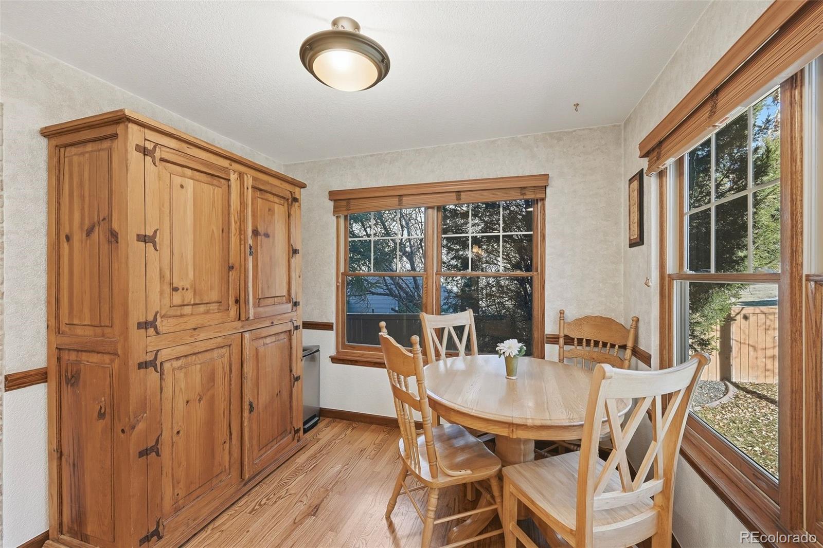 9372 Prairie View Drive Highlands Ranch, CO 80126 - Photo 12 of 50 a dining room with furniture and window