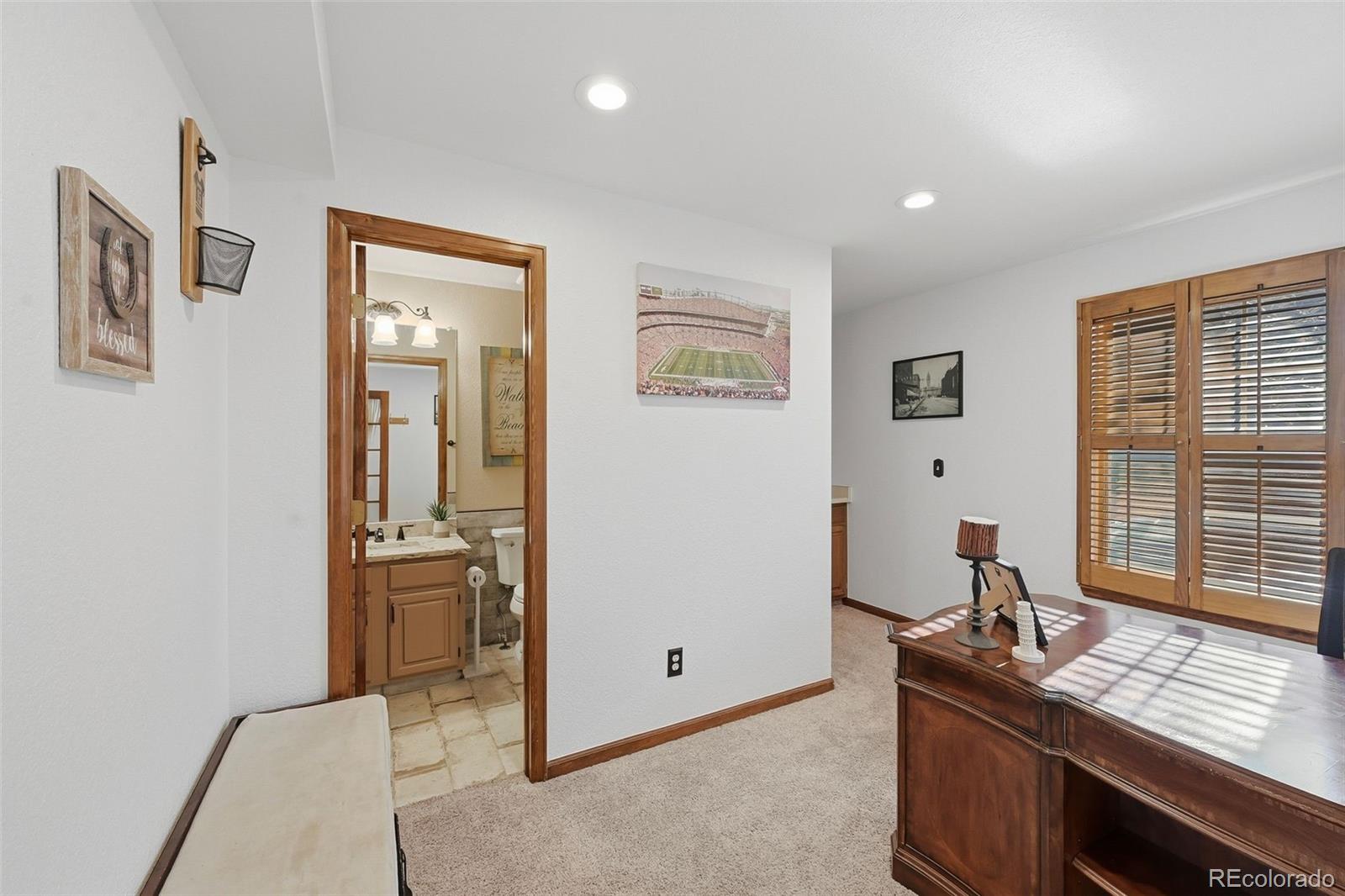 9372 Prairie View Drive Highlands Ranch, CO 80126 - Photo 19 of 50 a view of a workspace with furniture and window
