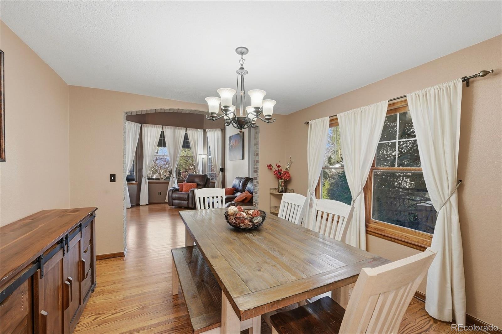 9372 Prairie View Drive Highlands Ranch, CO 80126 - Photo 21 of 50 a dining room with furniture and window
