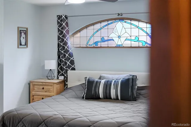 a bedroom with furniture and a window