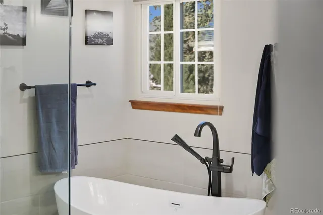 a view of a chairs and table on the balcony