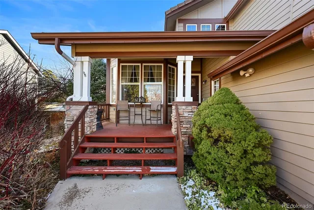 an aerial view of a house with a yard and large trees