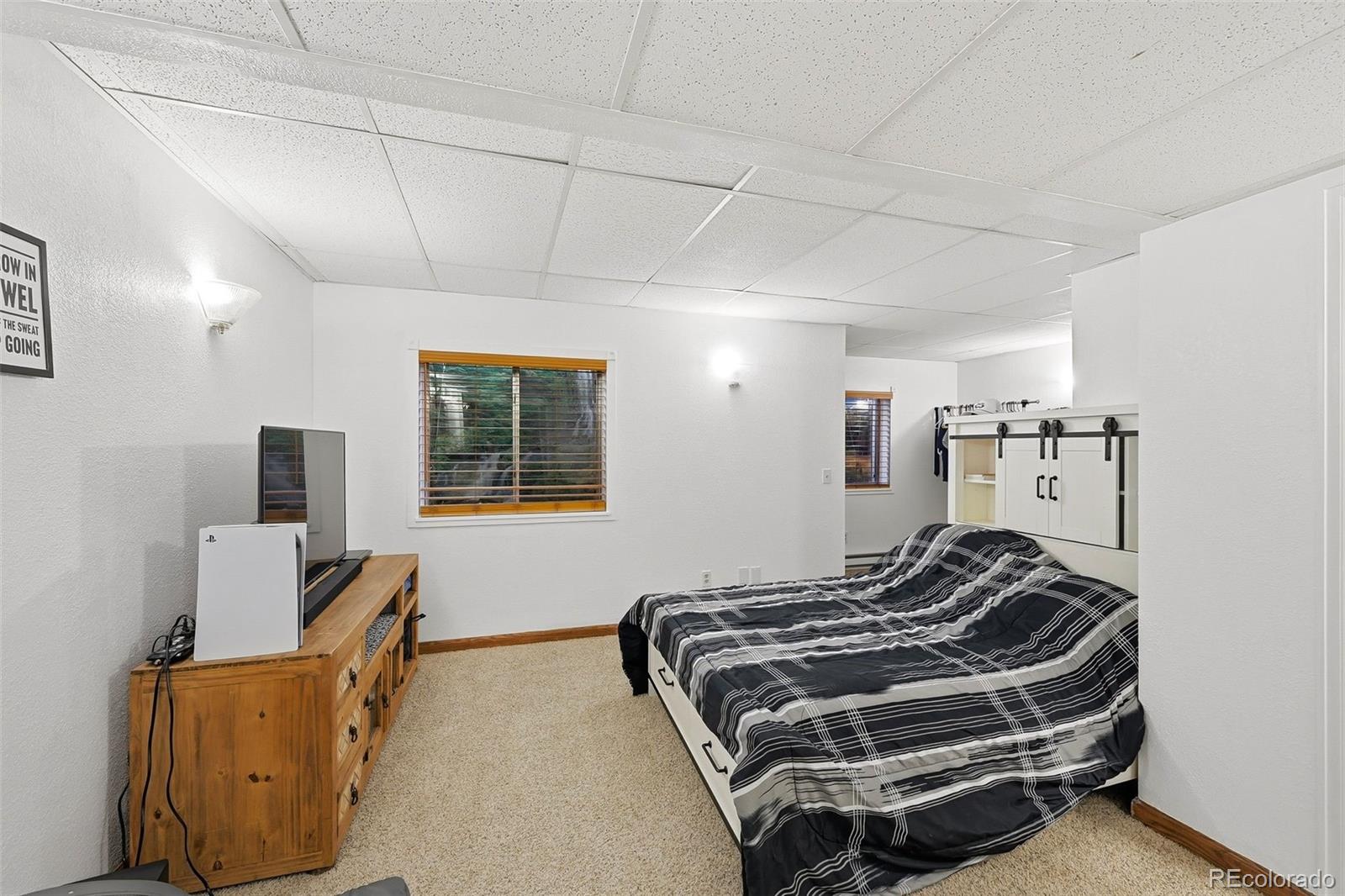 9372 Prairie View Drive Highlands Ranch, CO 80126 - Photo 40 of 50 a bedroom with bed and window
