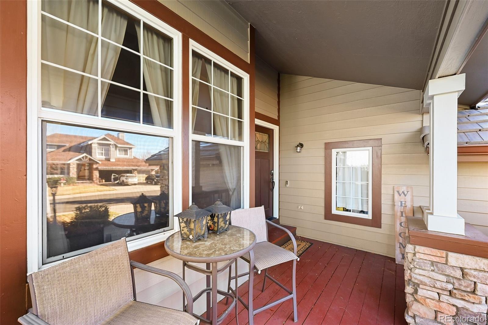9372 Prairie View Drive Highlands Ranch, CO 80126 - Photo 4 of 50 a view of a dining room with furniture and wooden floor
