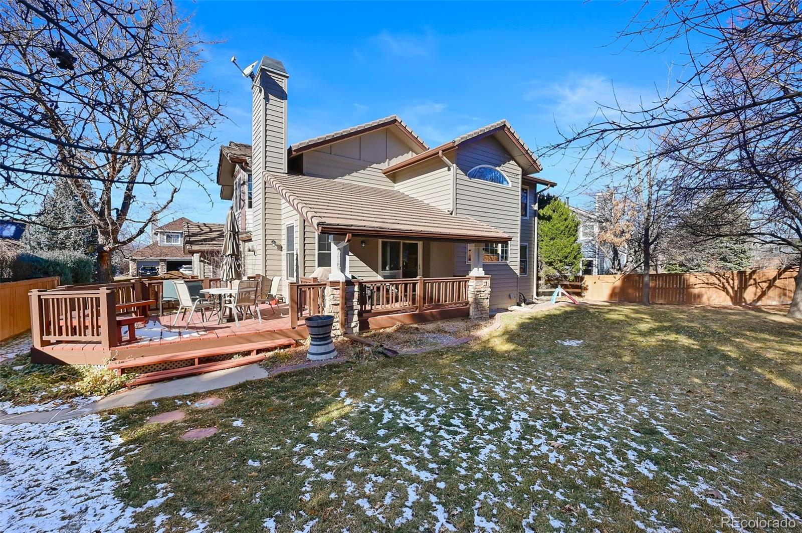 9372 Prairie View Drive Highlands Ranch, CO 80126 - Photo 41 of 50 a view of a house with a yard patio and sitting area