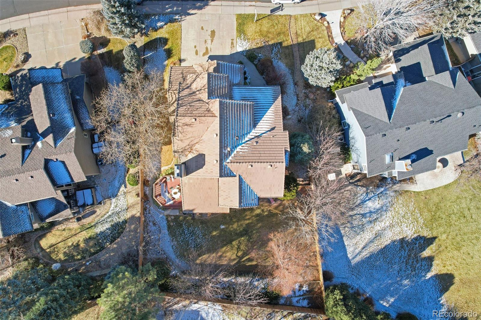 9372 Prairie View Drive Highlands Ranch, CO 80126 - Photo 45 of 50 an aerial view of a house with a yard and large trees