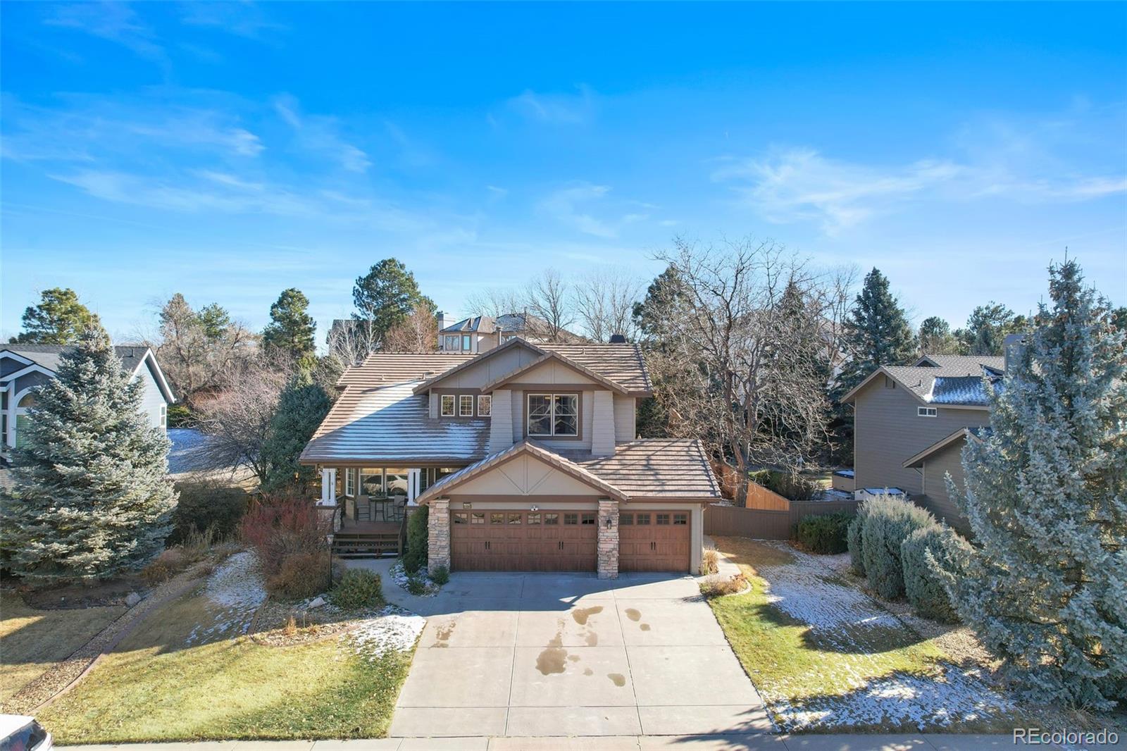 9372 Prairie View Drive Highlands Ranch, CO 80126 - Photo 50 of 50 a front view of a house with a yard and garage