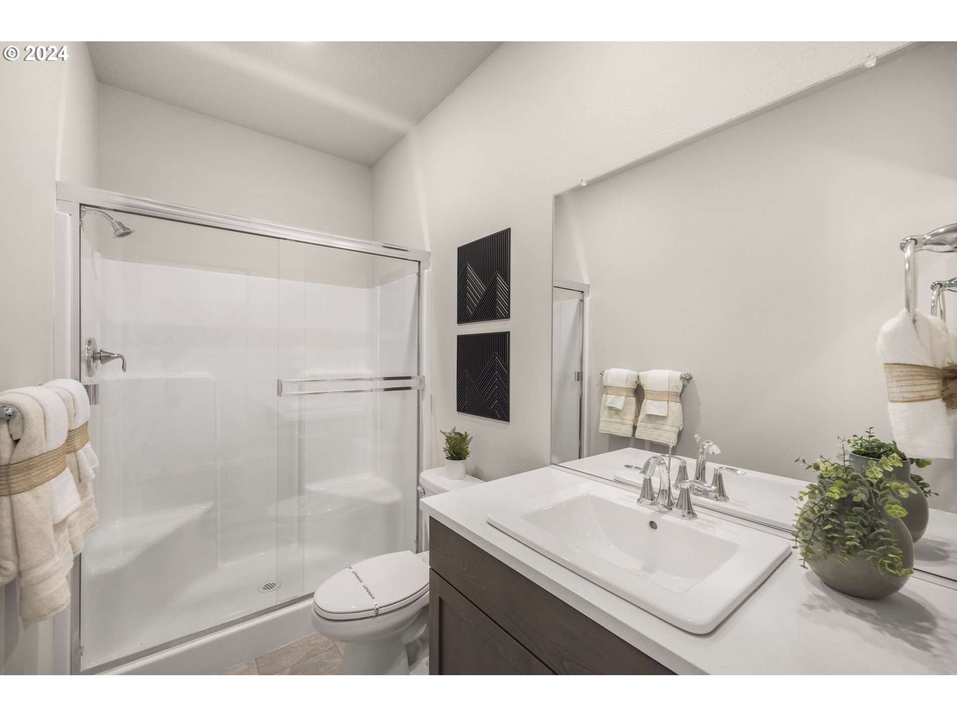 2735 South 9th Circle Ridgefield, WA 98642 - Photo 29 of 38 a bathroom with a sink toilet and shower