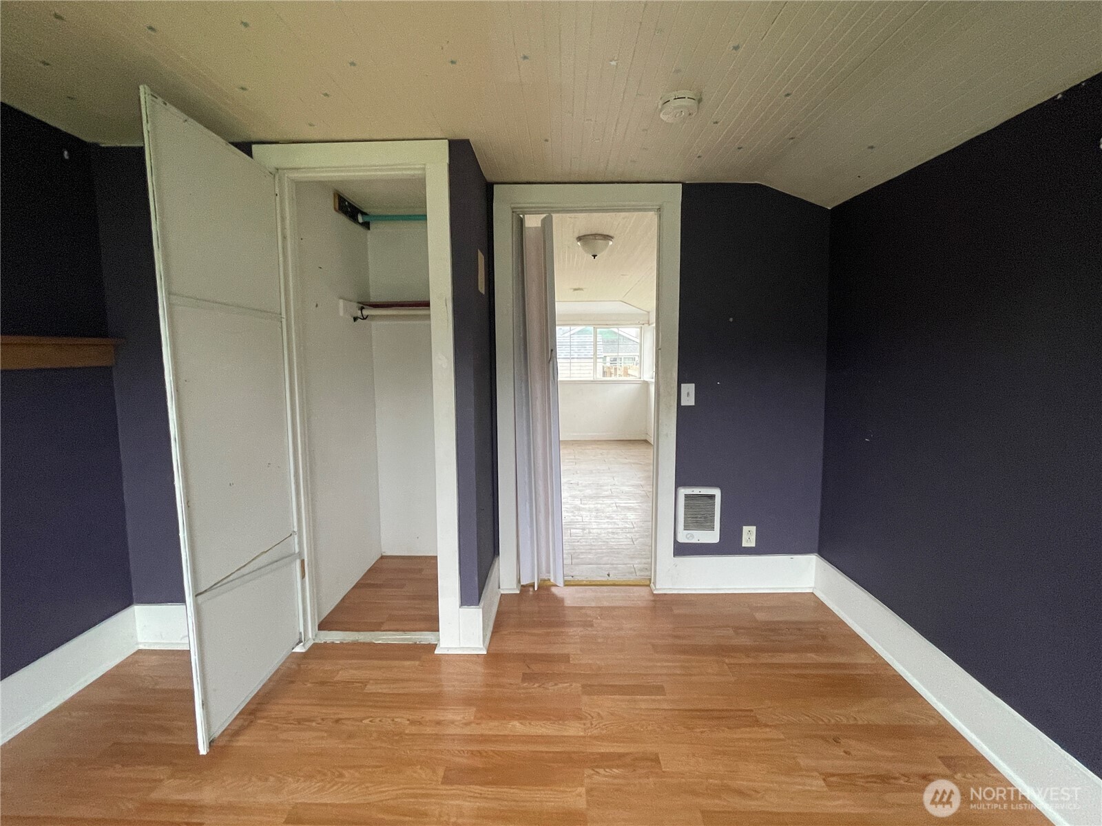 154 Southwest 11th Street Chehalis, WA 98532 - Photo 16 of 29 a view of an empty room with wooden floor and a bathroom