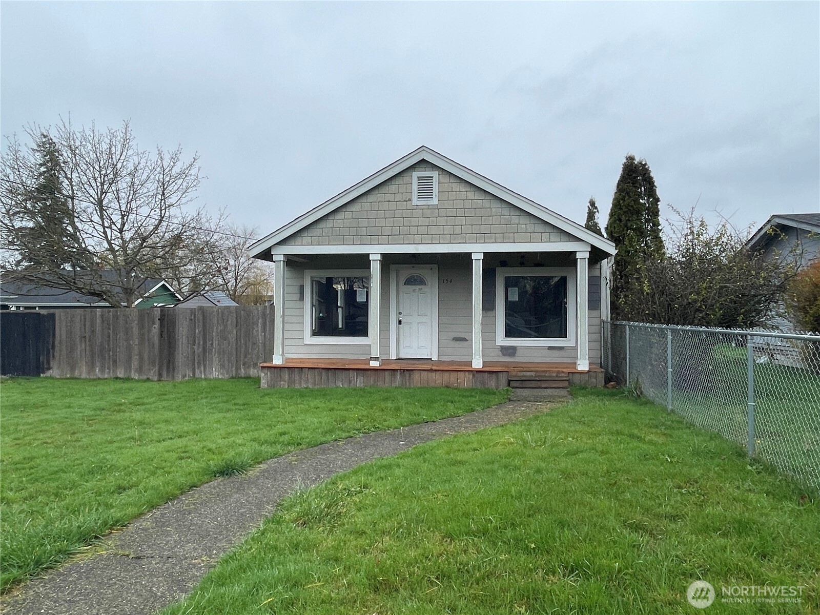 154 Southwest 11th Street Chehalis, WA 98532 - Photo 2 of 29 a view of a house with a yard and porch