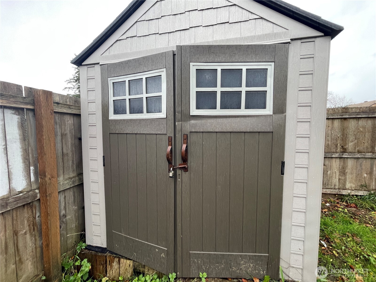 154 Southwest 11th Street Chehalis, WA 98532 - Photo 22 of 29 a view of a house with a door and wooden walls