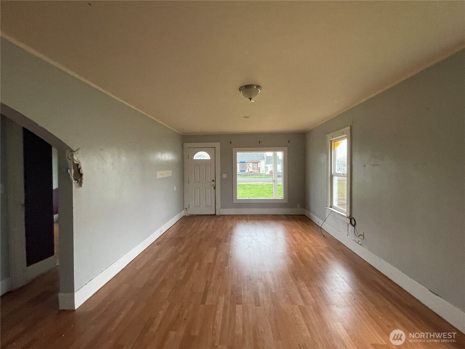 154 Southwest 11th Street Chehalis, WA 98532 - Photo 3 of 29 a view of empty room with window and wooden floor
