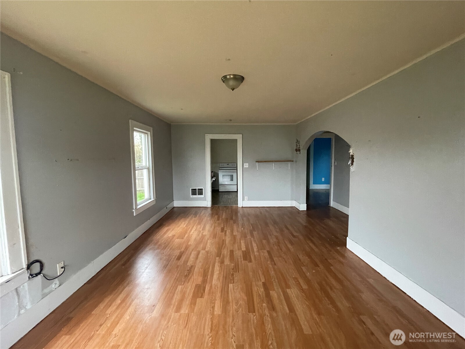 154 Southwest 11th Street Chehalis, WA 98532 - Photo 4 of 29 wooden floor in an empty room with a window
