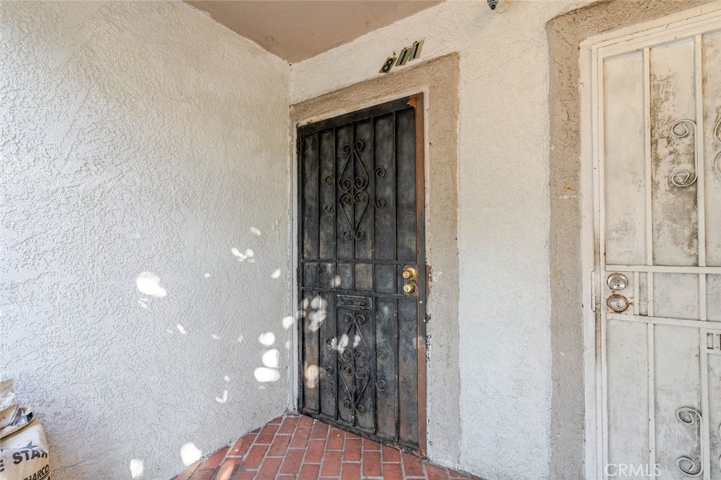 811 East 43rd Place Los Angeles, CA 90011 - Photo 13 of 31 a view of a hallway with wooden floor