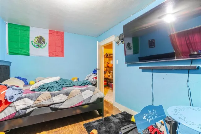 a bed room with a bed and a furniture